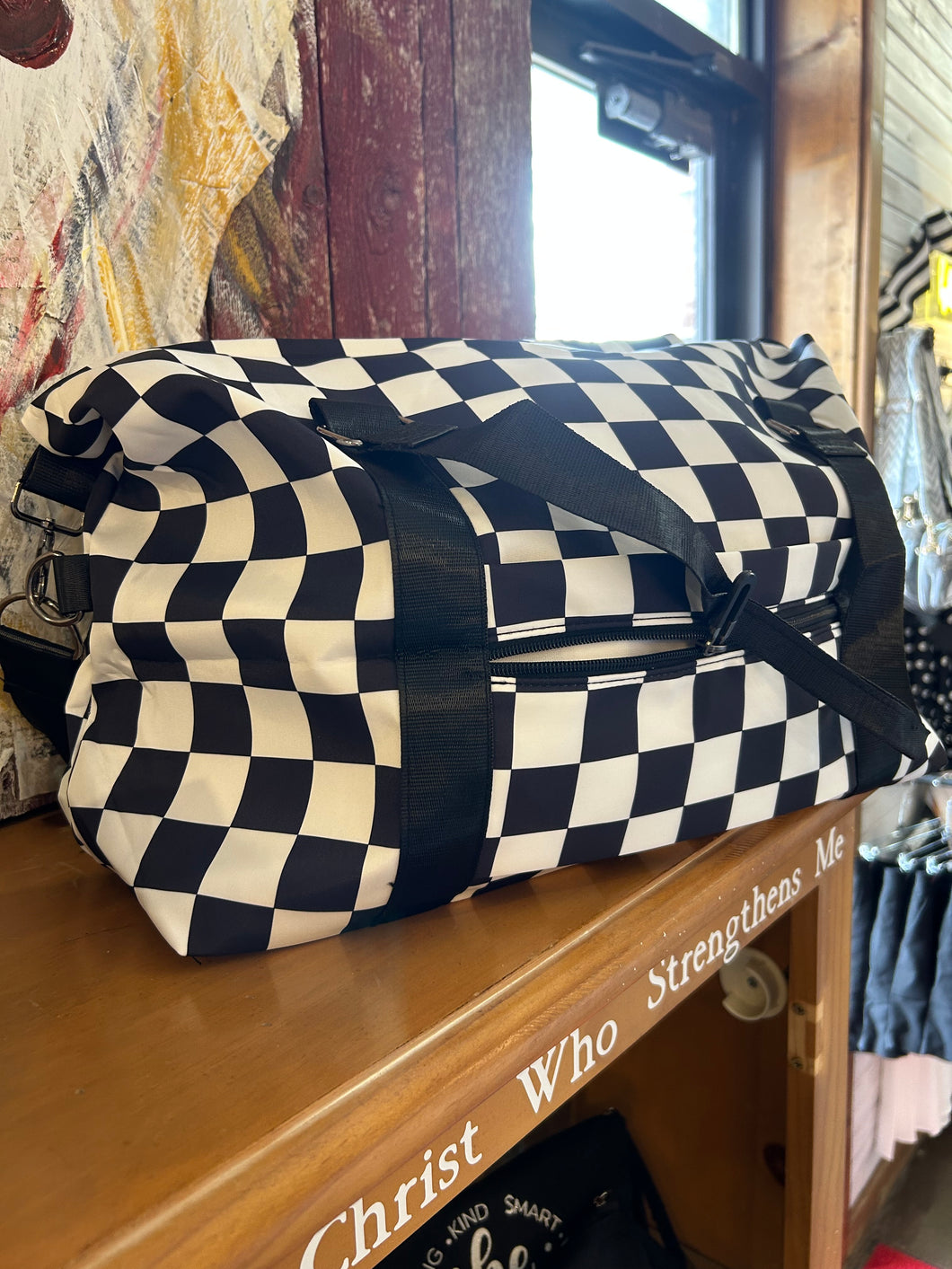 Bag: Black checkered travel bag